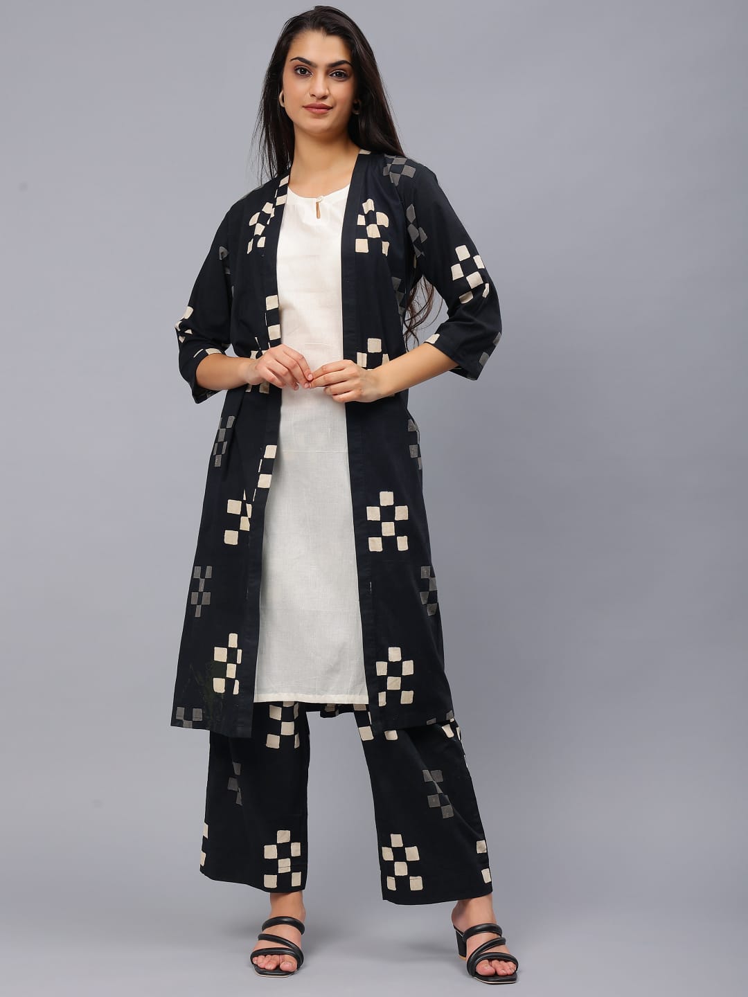 White Sleeveless Kurti with Black Printed Trouser with Pocket